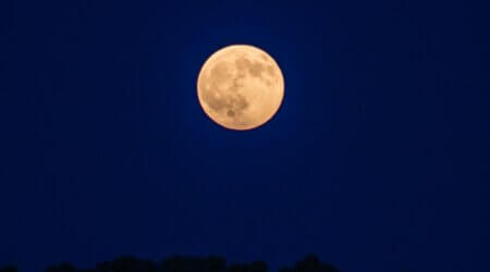 A full moon in the desert