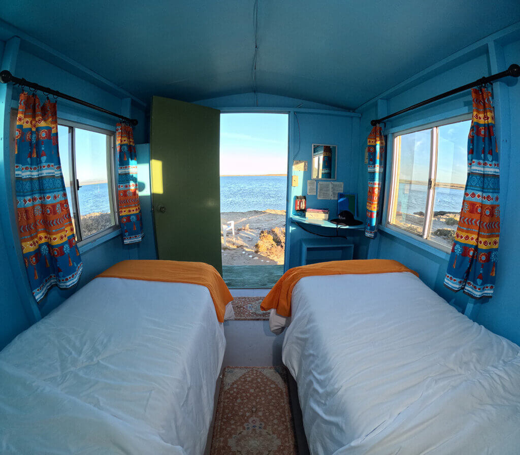 Two beds with a beach view